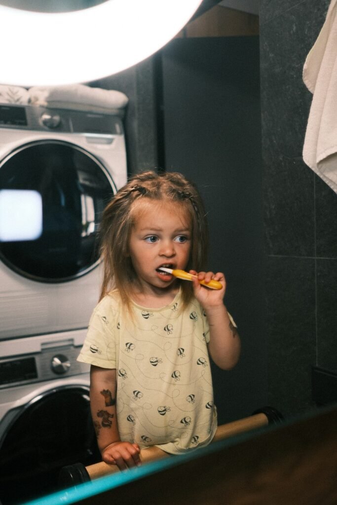 Child practicing healthy tooth brushing