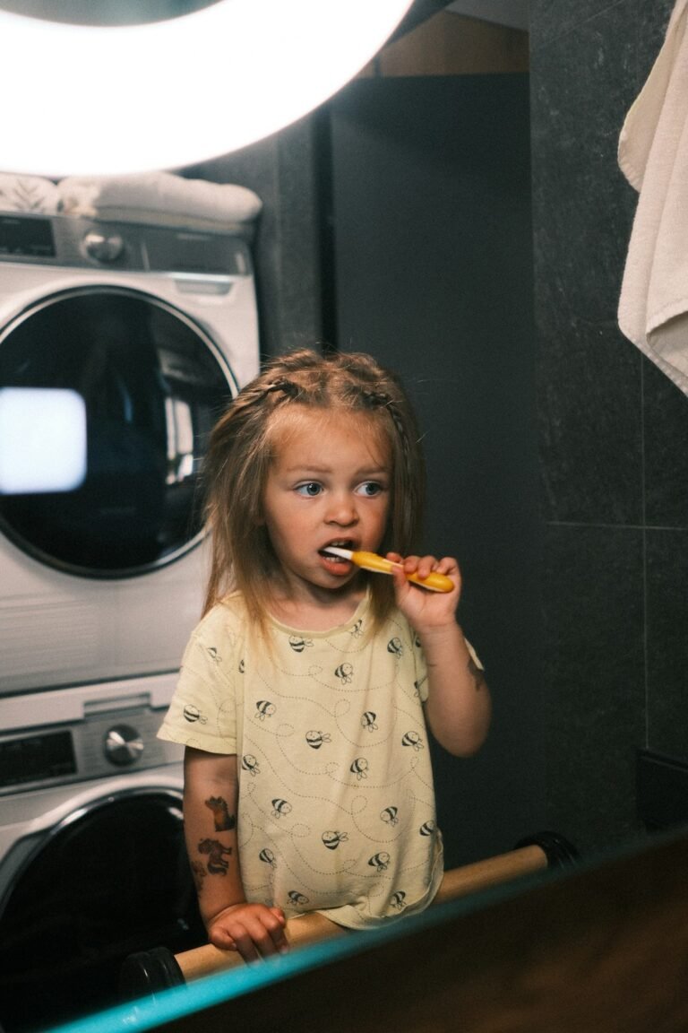 Child practicing healthy tooth brushing