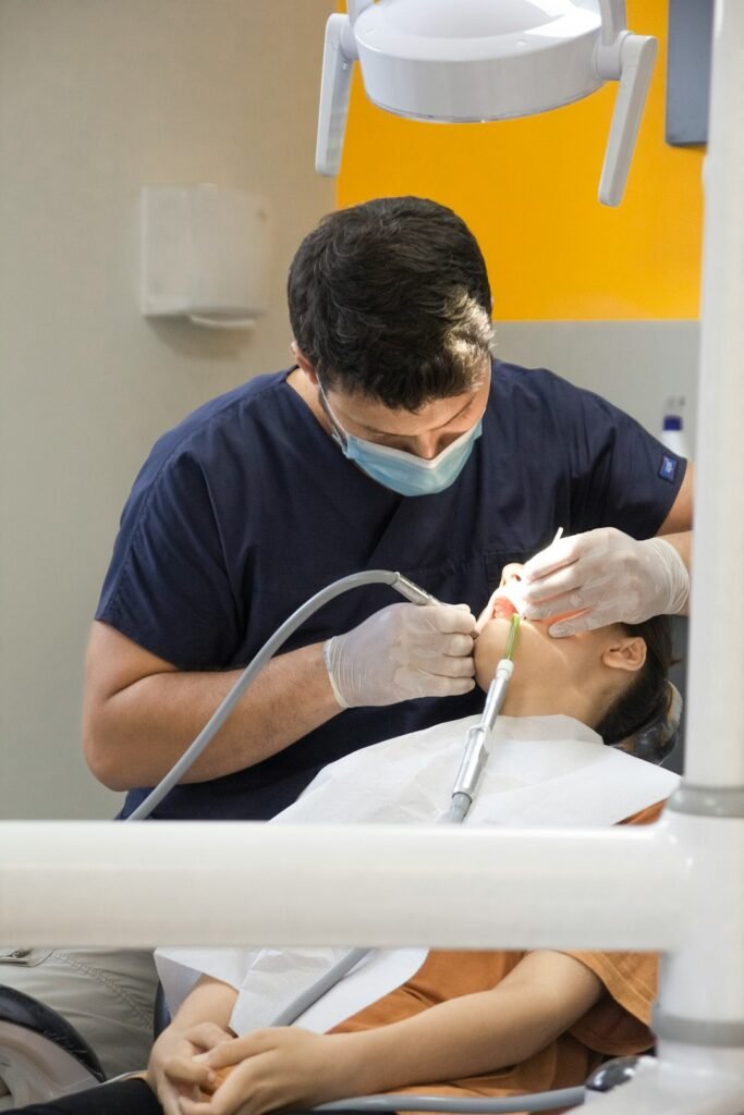 Dental professional providing preventive care to a patient