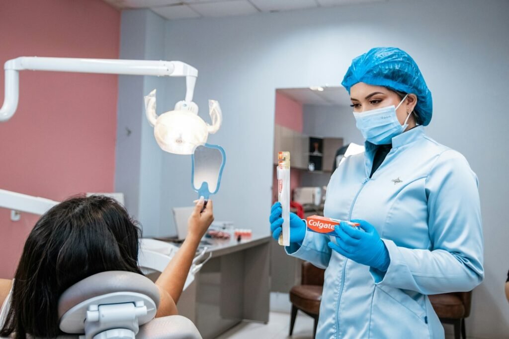 Dental professional holding a toothbrush in a clinic
